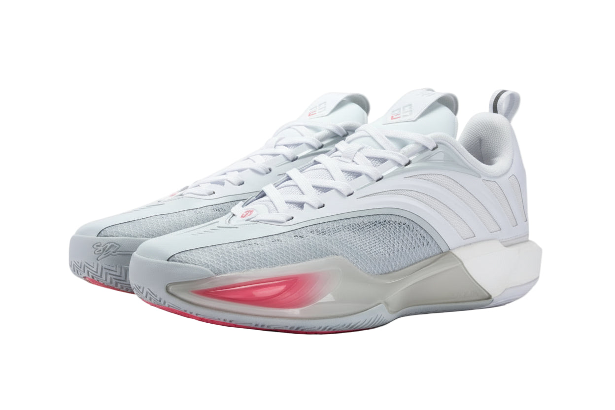 White athletic shoes with red accents on a white background