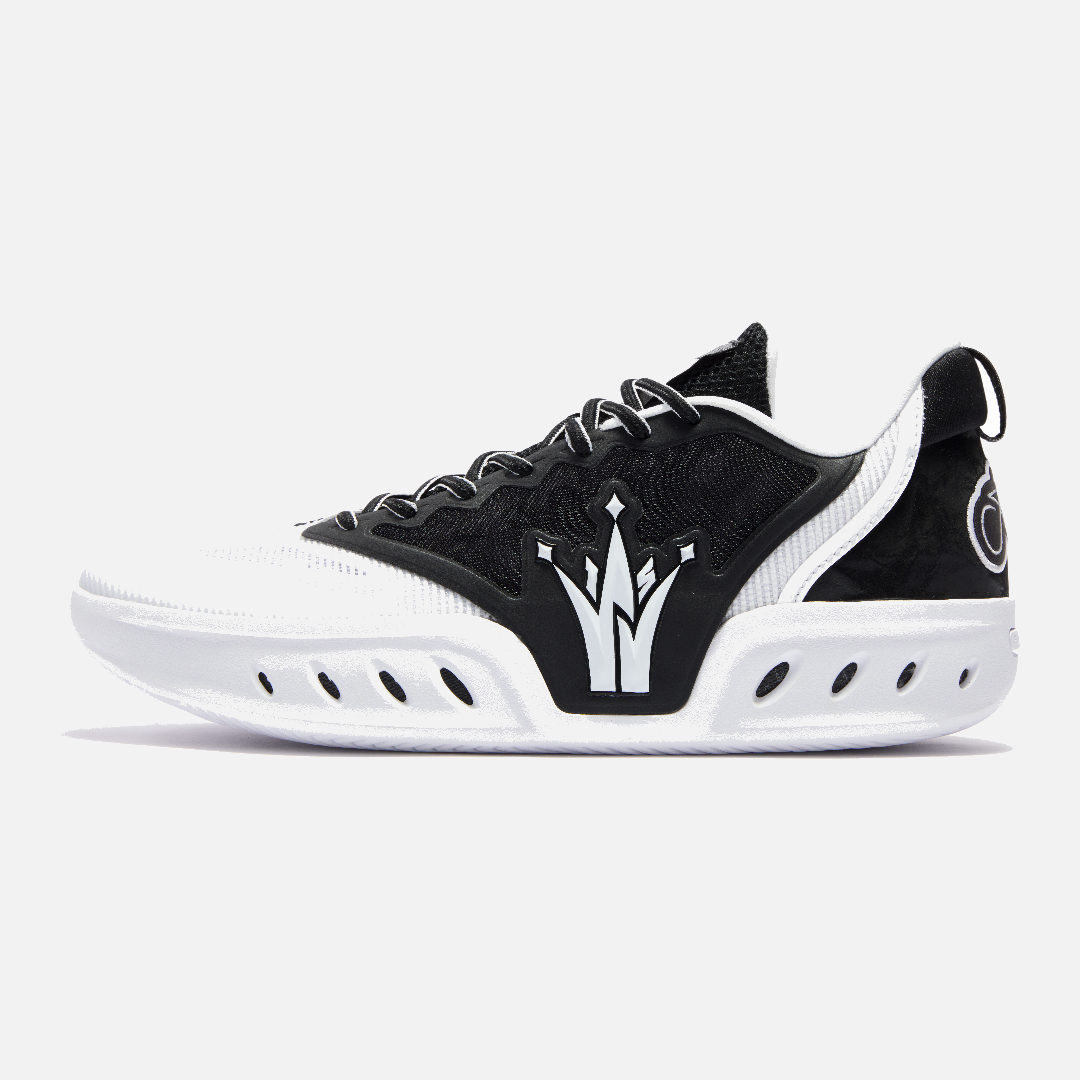 Black and white sneaker with a distinctive logo on a light gray background