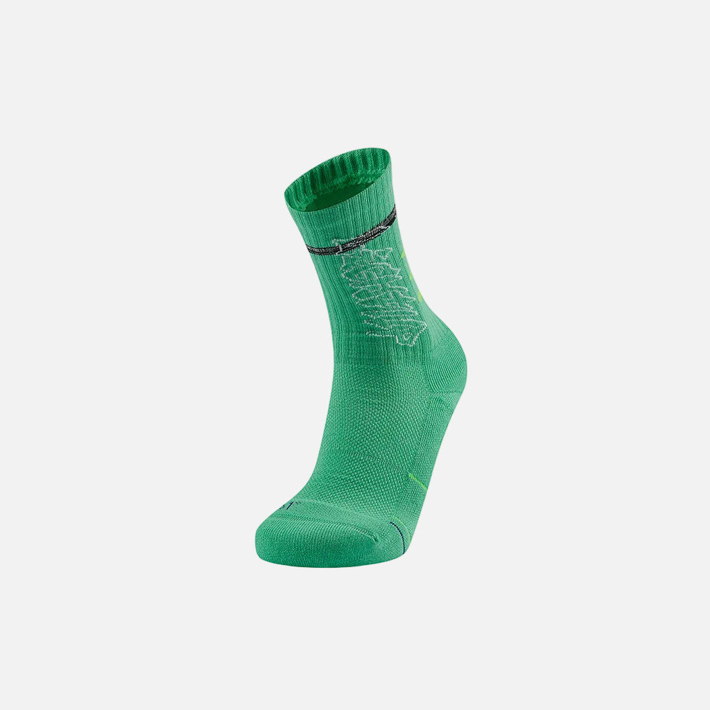A green basketball sock with a pattern design and a small logo in pink near the ankle area.